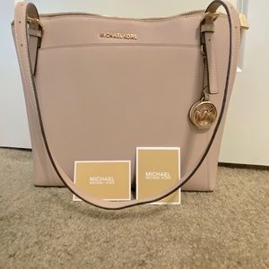 Michael Kors large travel tote with zipper close. Light cream w/gold hardware